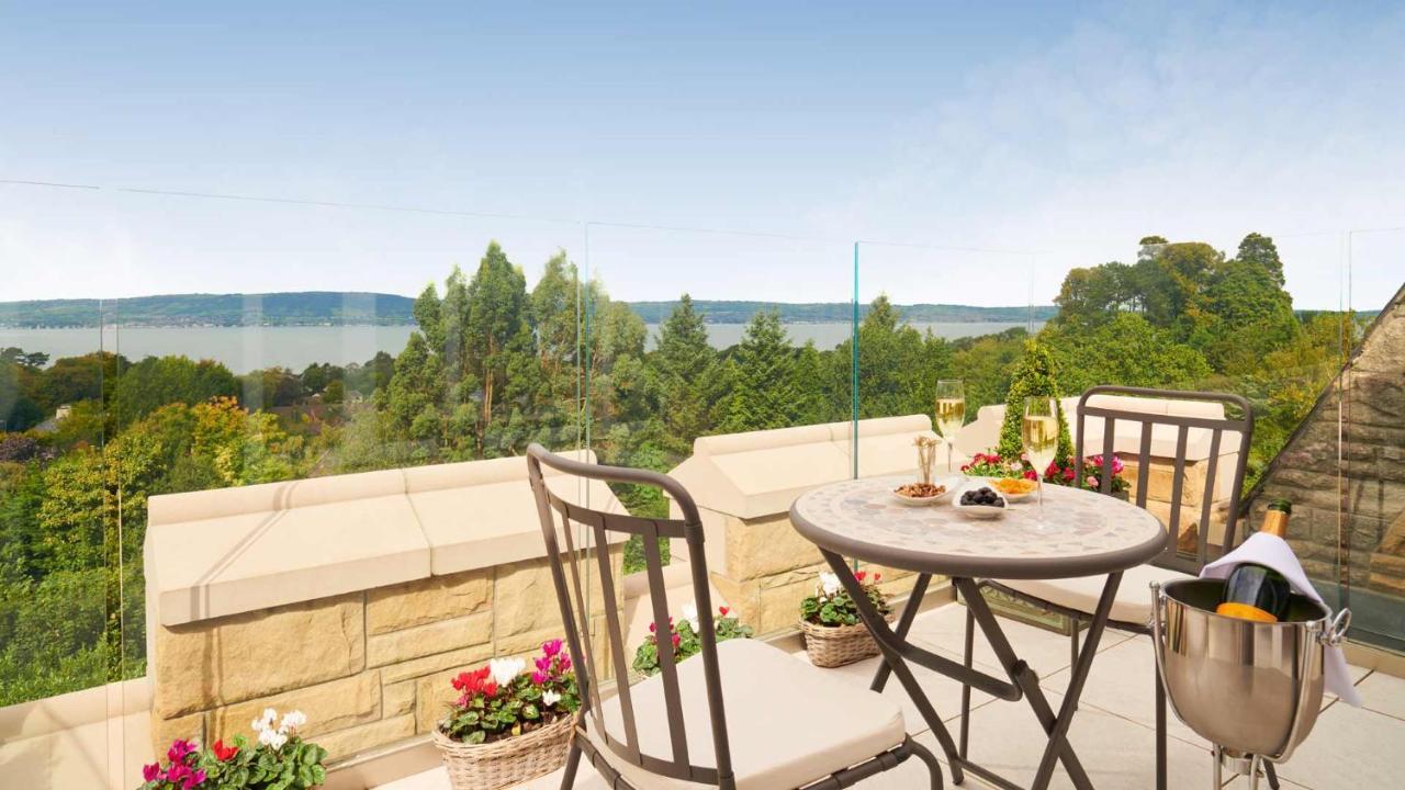 The Culloden Estate And Spa Holywood  Luaran gambar A view of the lake from the balcony of a house in the village